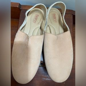 Born tan suede flats with strap around heel.